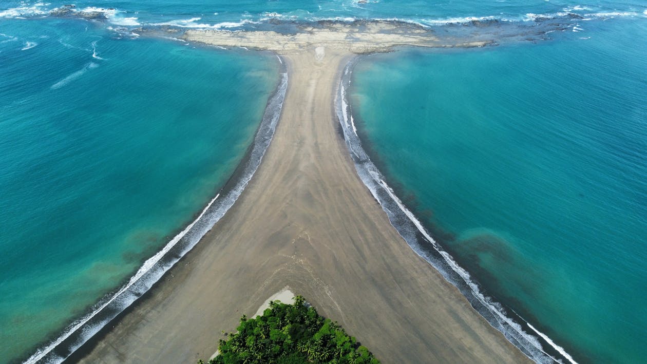 Aerial view of the whale-tail tombolo at Playa Uvita, Marino Ballena National Park