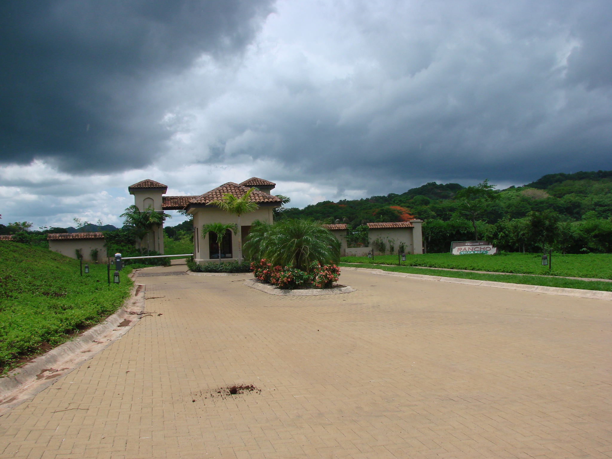 Luxury gated development in Guanacaste with forested hills in background